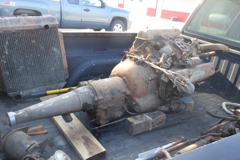 Here is the motor and transmission in the back of the truck.