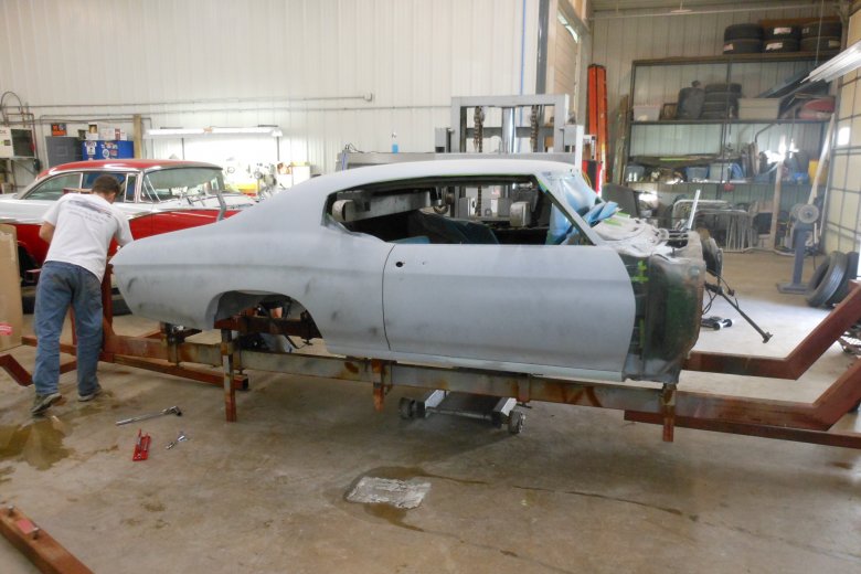 Here we are putting the body on a roll so we can remove and replace the floor pans as well as finish the underside of the car before painting.