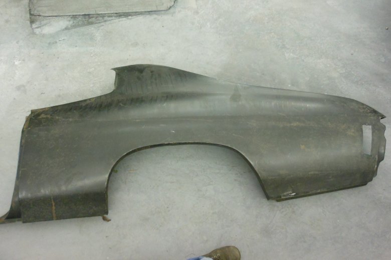 NOS (New Old Stock) driver's rear quarter panel.